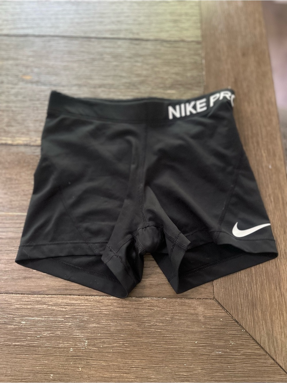 Nike Black Women's Athletic Compression Shorts with White Swoosh